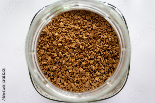 Instant coffee granules in a round jar