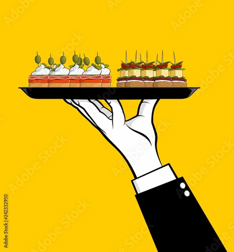 Waiter serving canapes