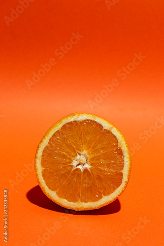 Fresh Oranges on orange background