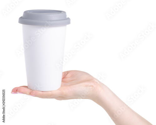 White cup mug with gray lid in hand on white background isolation
