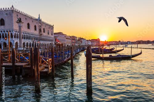 Doge's Palace and gondolas nearby at sunset, Venice, Italy © AlexAnton