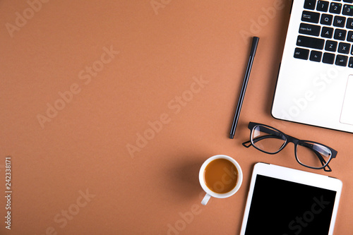 Content creator table concept. Laptop computer, modern wireless electronic gadget, supplies on clean desktop. Background, copy space, close up, flat lay, top view. Creative writer's neat workspace.