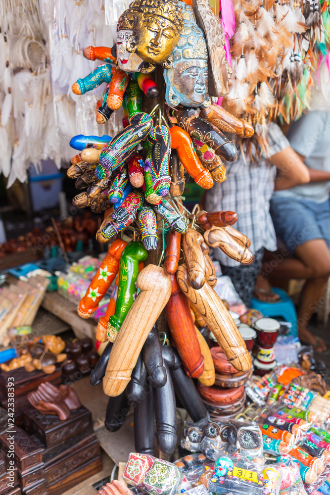 Balinese market. Souvenirs of wood and crafts of local residents. Colorful Souvenirs and figurines. Bali, Indonesia.