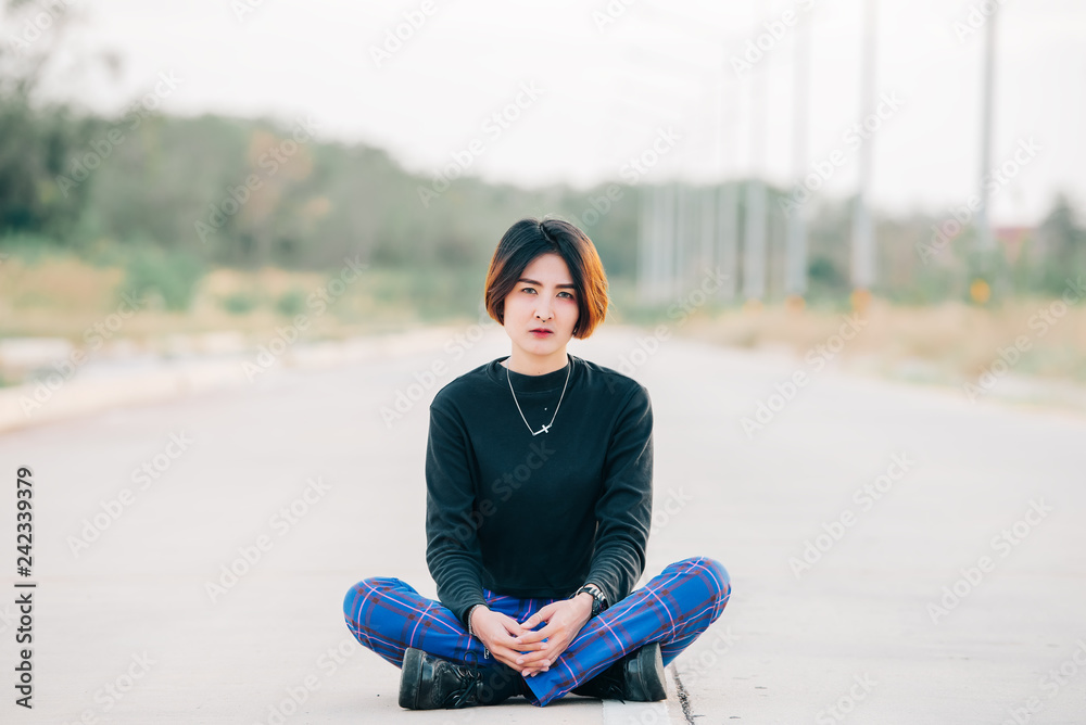 Portrait of beautiful asian chic girl pose for take a picture on the road,Lifestyle of teen thailand people,Modern woman happy concept,Punk rock style Portrait of beautiful asian chic girl pose for take a picture on the road,Lifestyle of teen thailand people,Modern woman happy concept,Punk rock style