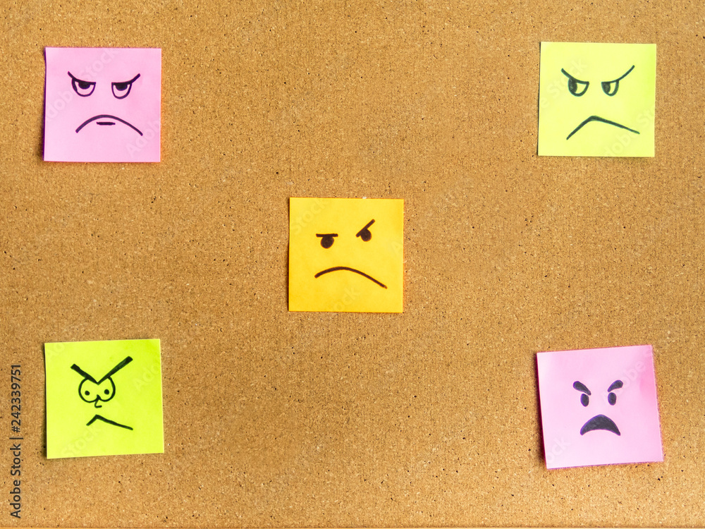 post-it notes with different face expression on cork board office school abstract concept photo post-it notes with different face expression on cork board office school abstract concept photo