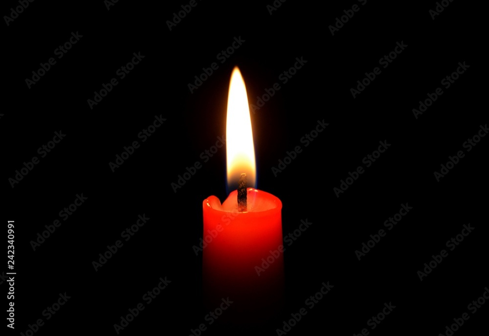 Burning candle in the dark Burning candle in the dark