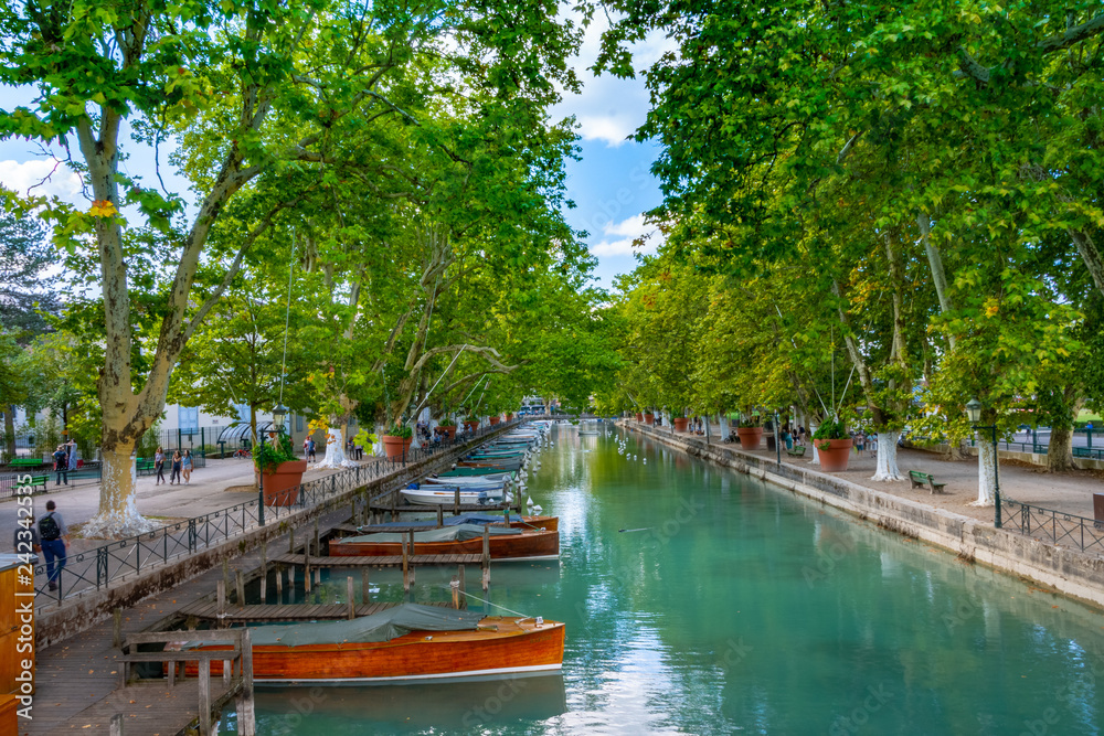 ANNECY, France - September 7 2018: Canal du Vasse as seen from Pont des Amours inland. Located in the Auvergne-Rhône-Alpes region in southeastern France, Annecy is often called the Venice of the Alps ANNECY, France - September 7 2018: Canal du Vasse as seen from Pont des Amours inland. Located in the Auvergne-Rhône-Alpes region in southeastern France, Annecy is often called the Venice of the Alps