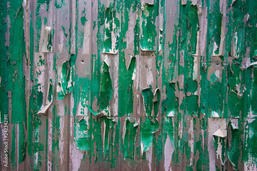 metal wall with peeling posters