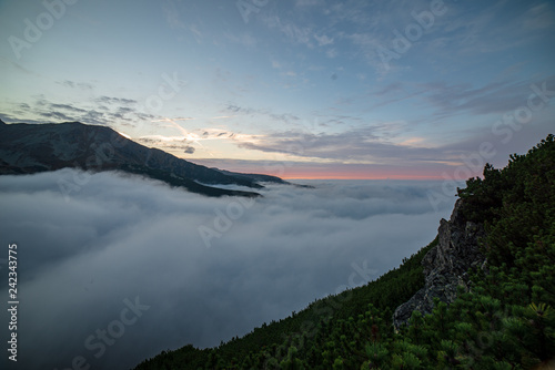 large misty cloud climbing mountain valley in slovakia  Tatra