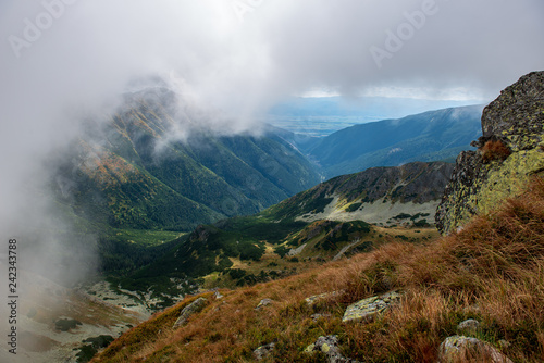 rocky Tatra mountain tourist hiking trails under blue sky in Slovakia