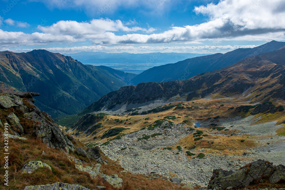 rocky Tatra mountain tourist hiking trails under blue sky in Slovakia