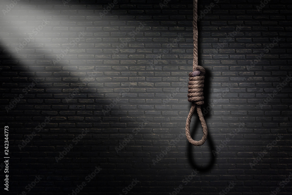 a rope loop on black brick wall background. Failure and despair concept  ,Death is the solution Stock Photo