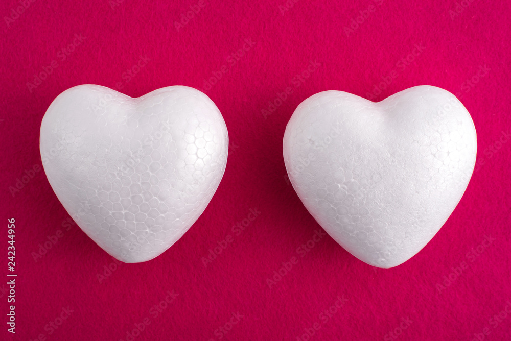 Obraz premium White foam heart on a red felt background