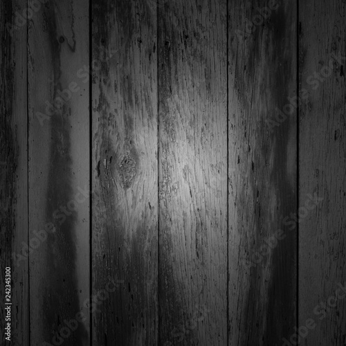 black and white old shabby vertical planks with stains, grunge, texture, background with vignetting 