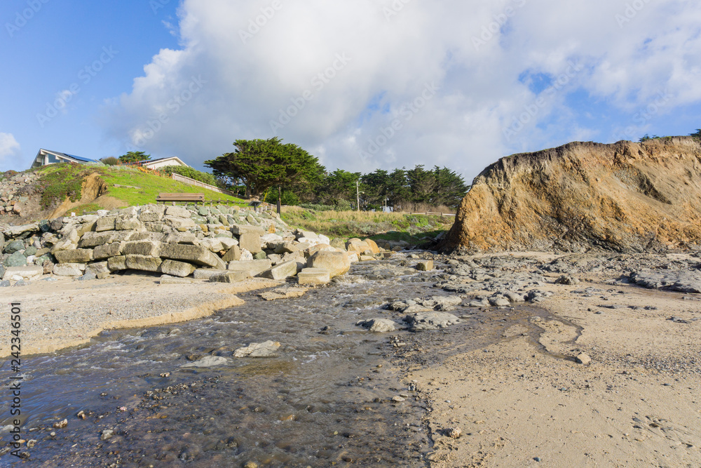 Creek flowing in to the Pacific Ocean at low tide, Moss Beach, Fitzgerald Marine Reserve, California