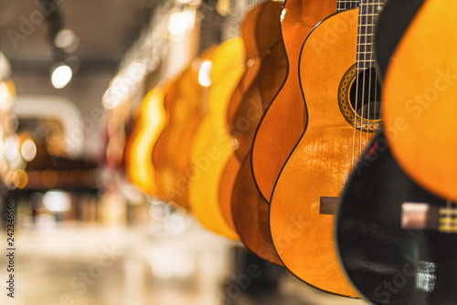 guitars, showcase with guitars hanging in a row