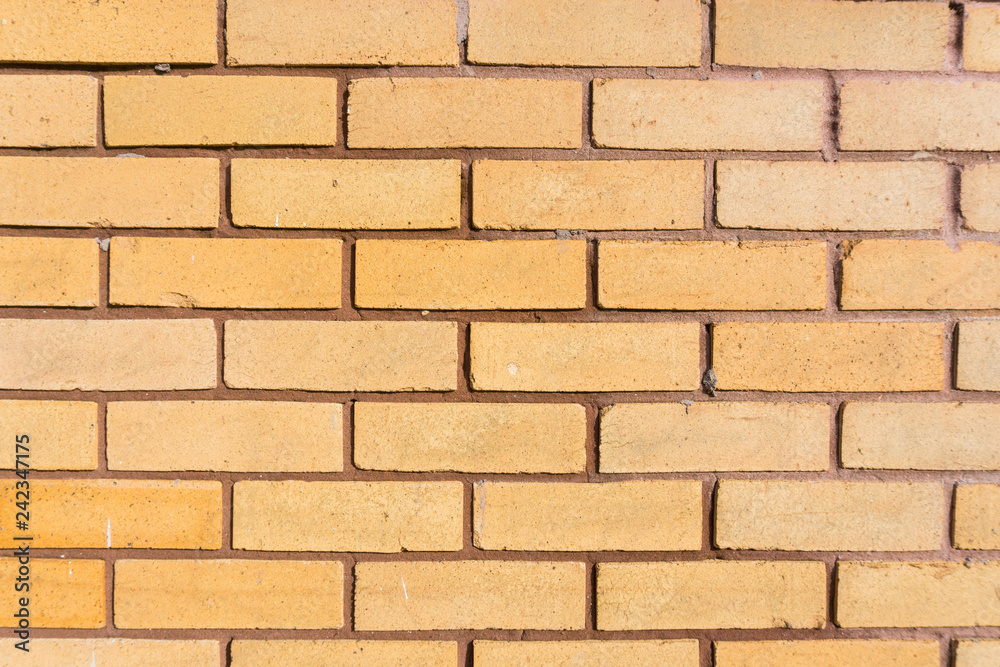 Fototapeta premium Pomarańczowy mur z cegły