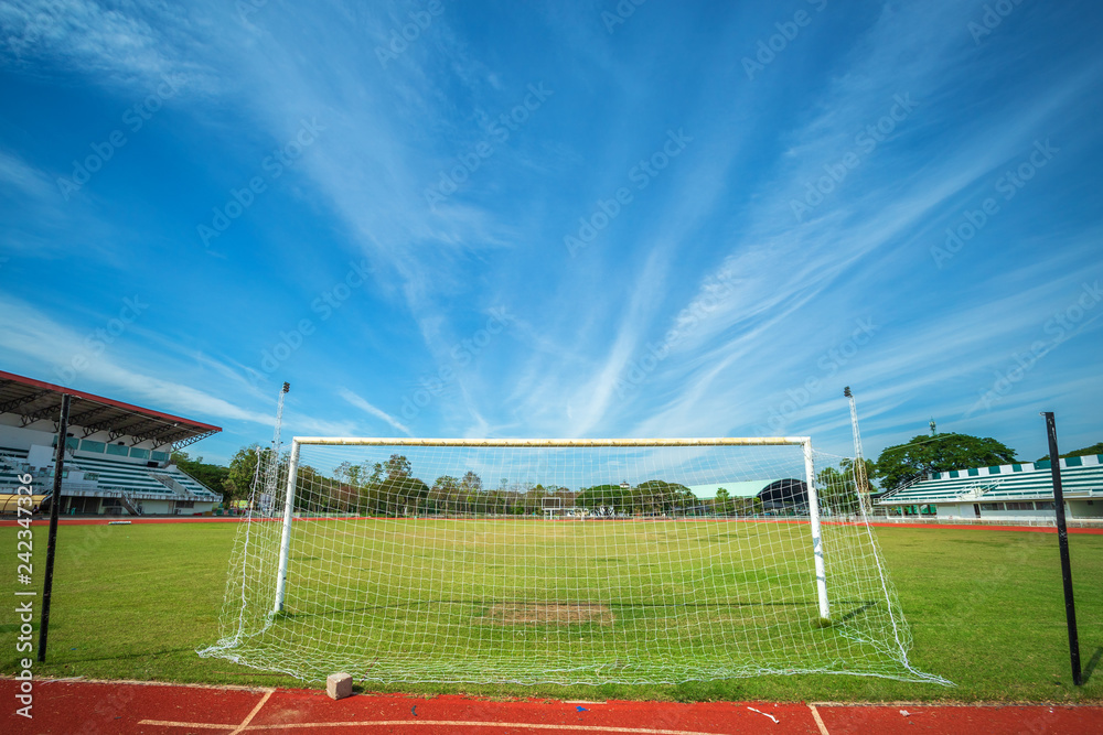 Obraz premium Stadium Soccer goal or football goal at of stadium with blue sky background.