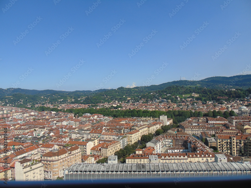 Obraz premium Turin, Italy - 12/01/2018: An amazing photography of the city of Turin from italy in summer days from the high and low part of the city including the beautiful river of Po from the center