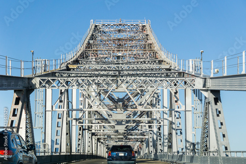 Fototapeta Naklejka Na Ścianę i Meble -  Driving on Richmond - San Rafael bridge (John F. McCarthy Memorial Bridge) on a sunny day, San Francisco bay, California