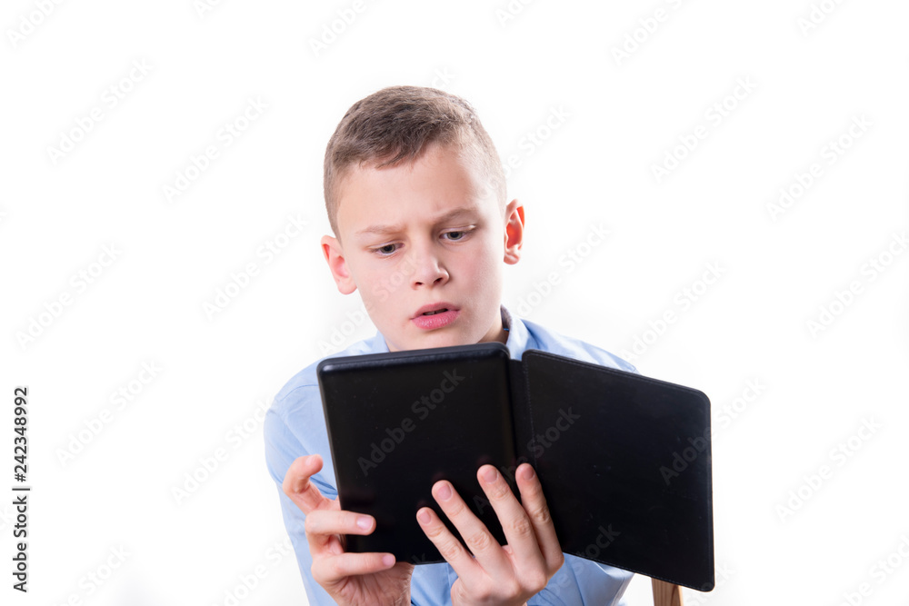 young child reading strained in an e book reader on white background young child reading strained in an e book reader on white background