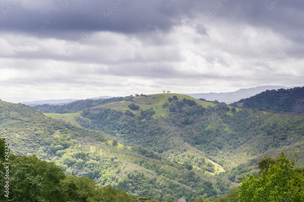 Hills and valleys in Rancho Canada del Oro Open Space Preserve on a stormy spring day, California