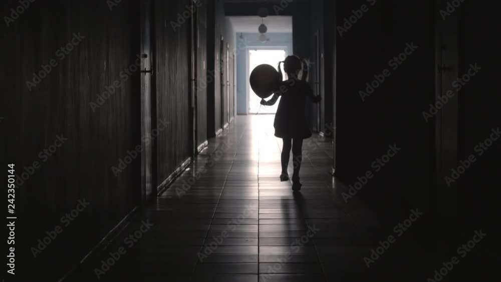 Rear view of silhouette of little girl with two ponytails holding balloon and running along hallway Rear view of silhouette of little girl with two ponytails holding balloon and running along hallway