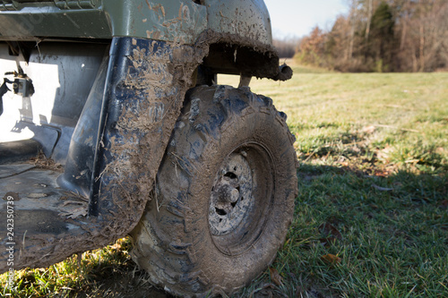 Muddy all-terrain vehicle