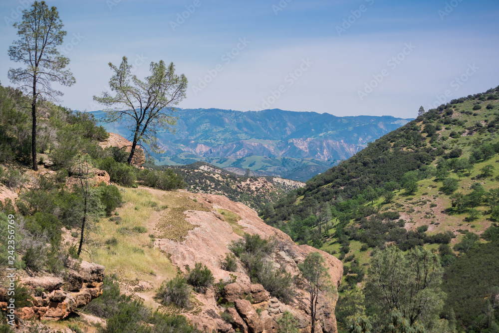 View from the high peaks trail towards the valleys and hills of Pinnacles National Park, California