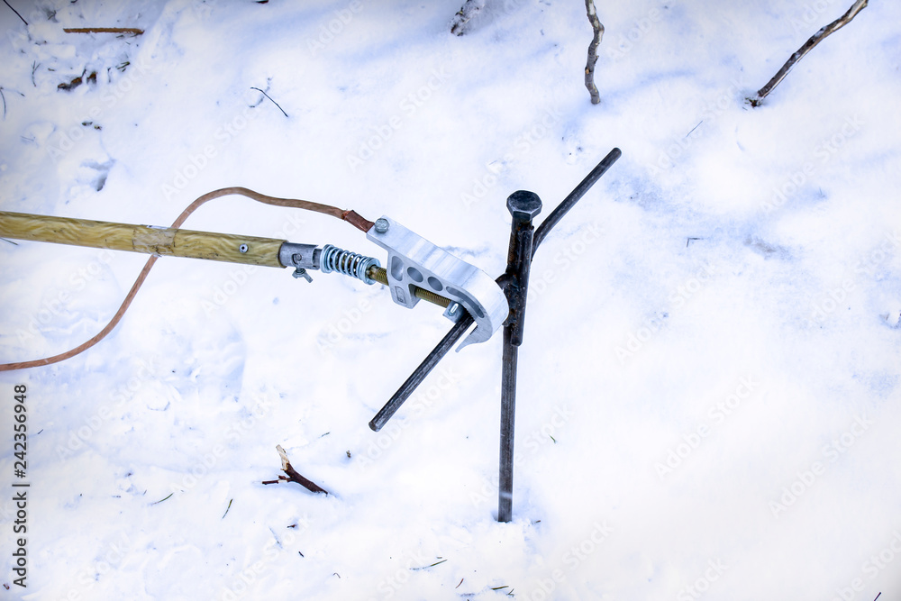 Portable grounding screwed into the snowy ground Portable grounding screwed into the snowy ground