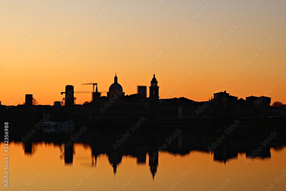 Italy: An outline of Mantova defined against the sky of the sunset.