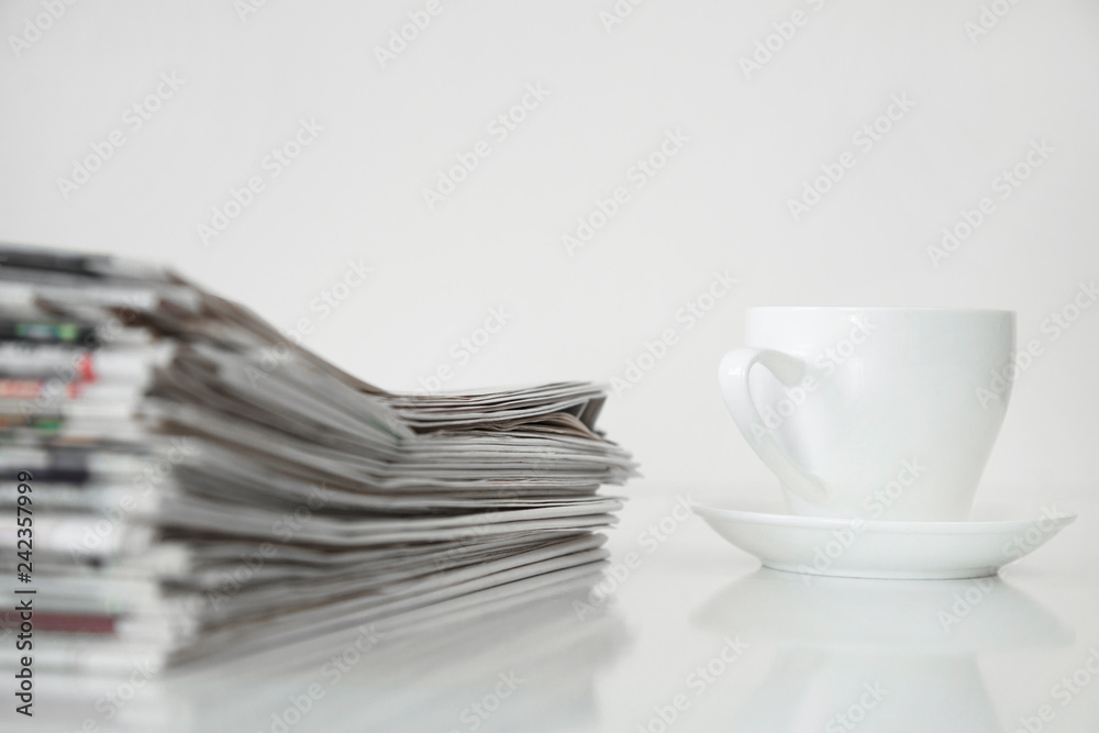 Reading newspaper on white background Reading newspaper on white background
