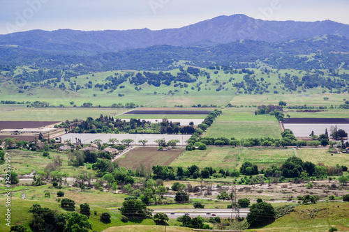 Aerial view of agricultural fields, Santa Cruz mountain in the background, south San Francisco bay, San Jose, California © Sundry Photography