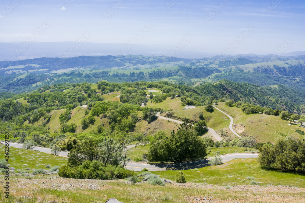 Fototapeta premium Dangerously winding road going down from Mt Hamilton summit, San Jose, San Francisco bay area, California
