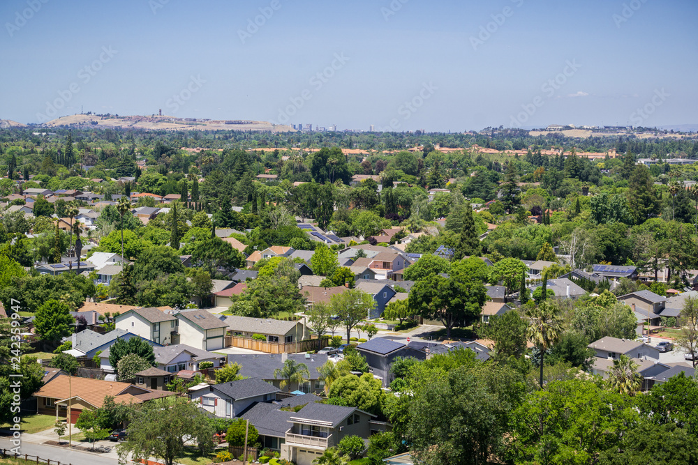 Residential neighborhood in south San Jose, Communications Hill and downtown San Jose in the background; view from Santa Teresa County Park, San Francisco bay area, California