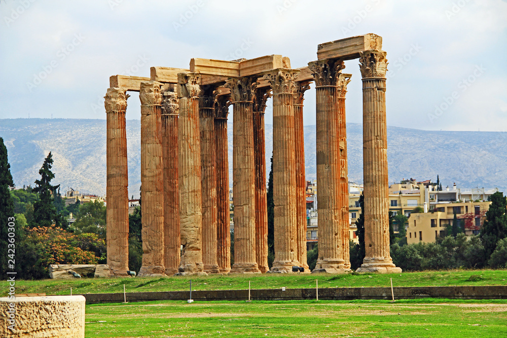 The huge archeological column ruins of the Temple of Olymian Zaus in Athens, Greece with blue sky copy space.