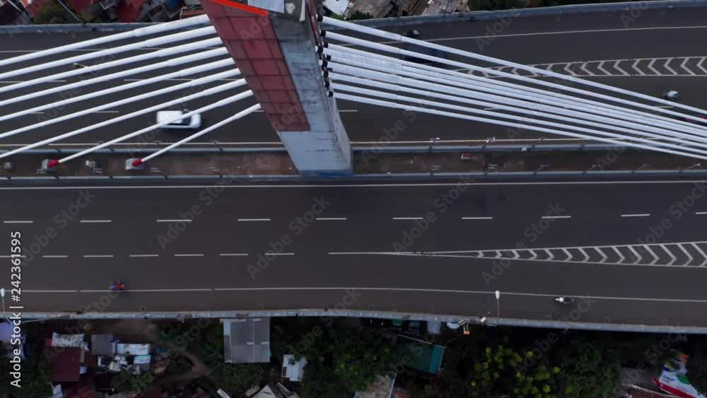 Bandung, Indonesia - January 02, 2019: Top down view of Pasupati Bridge with crowded residential houses background in Bandung, West Java, Indonesia. Shot in 4k resolution Bandung, Indonesia - January 02, 2019: Top down view of Pasupati Bridge with crowded residential houses background in Bandung, West Java, Indonesia. Shot in 4k resolution