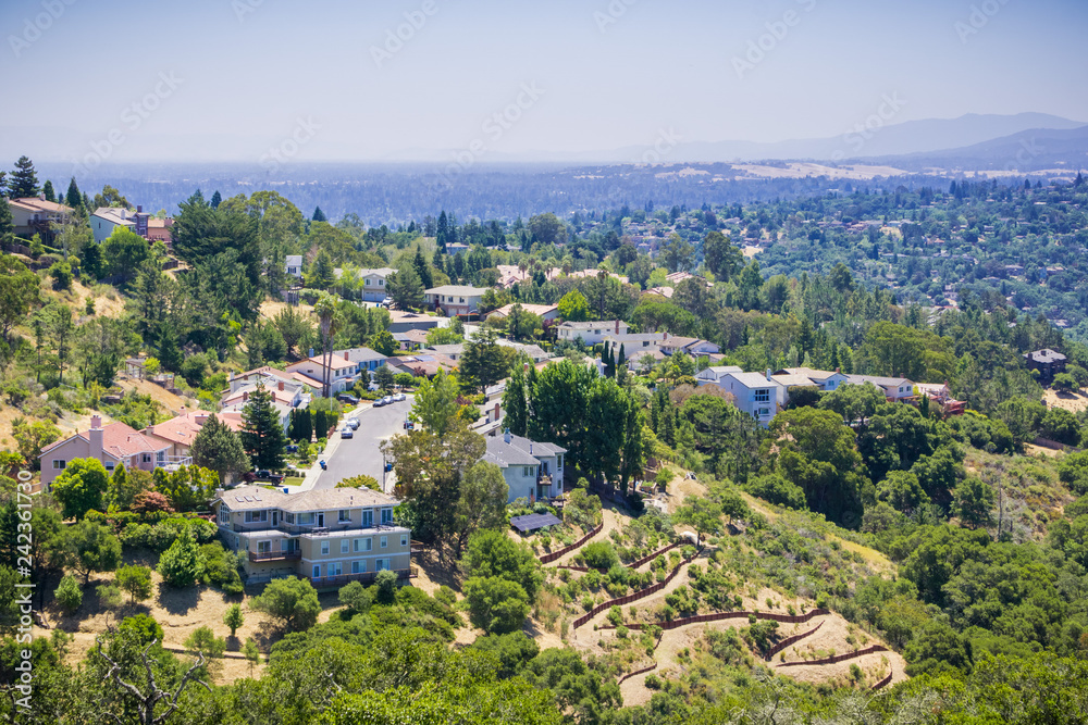 Aerial view of residential neighborhood on top of a hill near Pulgas Ridge OSP, San Carlos, San Francisco bay area, California