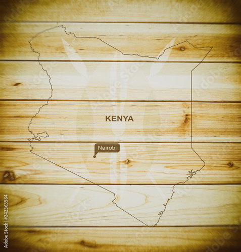 Kenya map on a wooden background, texture, blurred image.