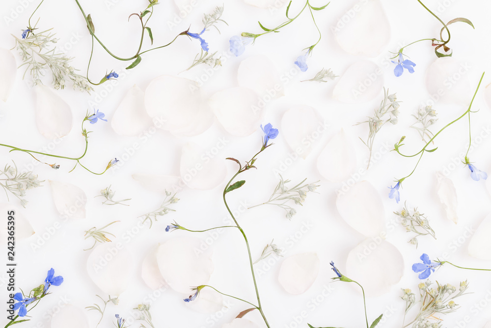 Fototapeta premium Festive flower composition on the white wooden background. Overhead view