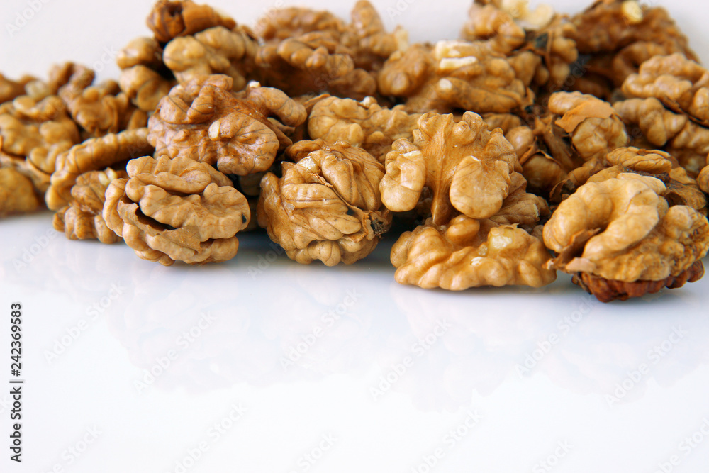 pile of walnuts on white background pile of walnuts on white background