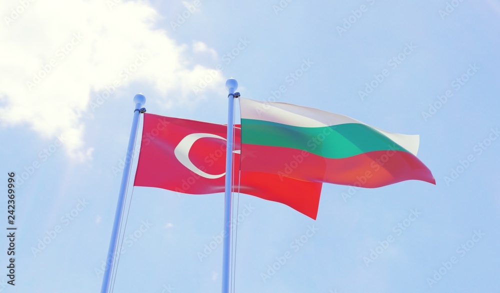 Turkey and Bulgaria, two flags waving against blue sky. 3d image