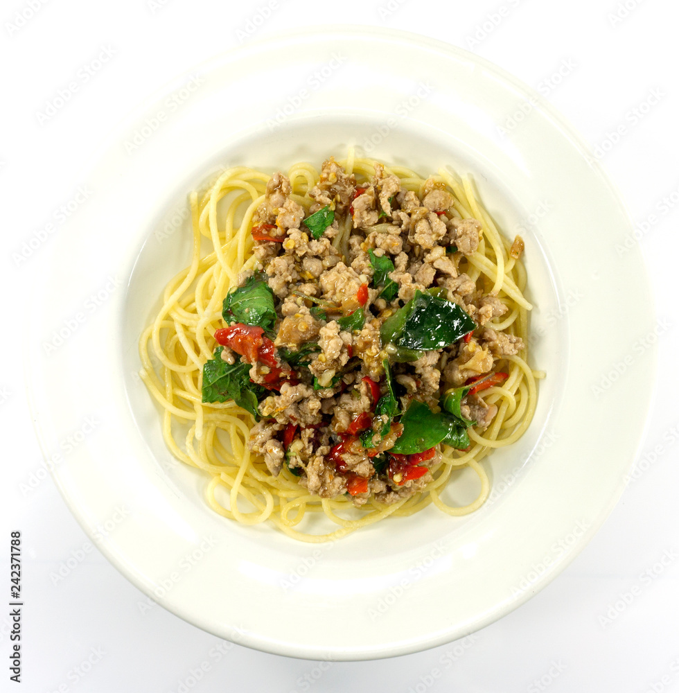 Spaghetti Fried Stir Basil with Minced pork in a dish white on floor table, ,food concept,Top view with copy space for your text. Spaghetti Fried Stir Basil with Minced pork in a dish white on floor table, ,food concept,Top view with copy space for your text.