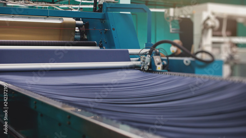 Knitted fabric. Textile factory in spinning production line and a rotating machinery and equipment production company.
