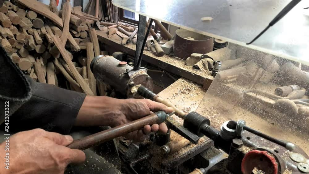 Carpenter Woodworking, detail of a worker with a lathe, shaping wood, etara, bulgaria