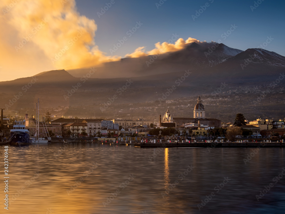 Fototapeta premium Volcanic ash plume at sunset