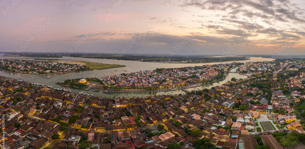 Panorama photo of Hoi An ancient town at pink sunset