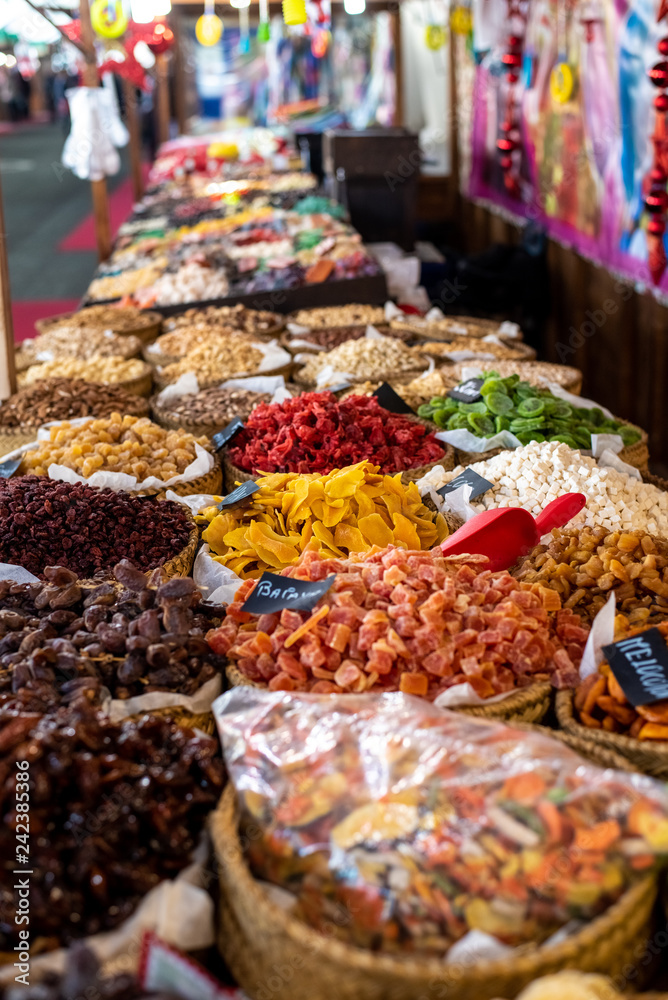 Raisins, dates and other candied fruits, sugar coated, for sale in a market.