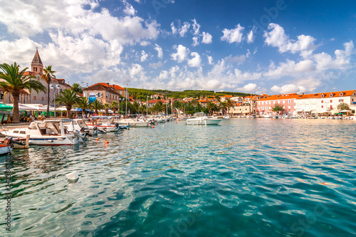 The Supetar harbor at sunny day on the Brac island, Croatia, Europe. photo