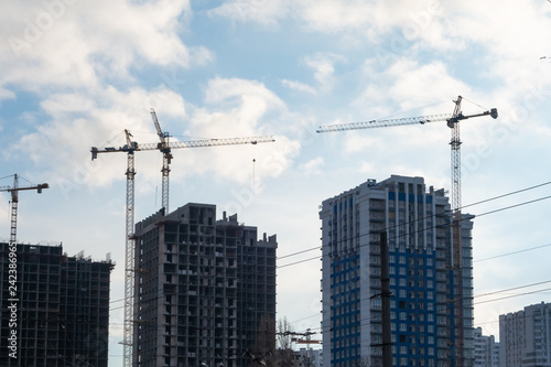 Construction of residential multi-storey buildings with the help of four tower cranes